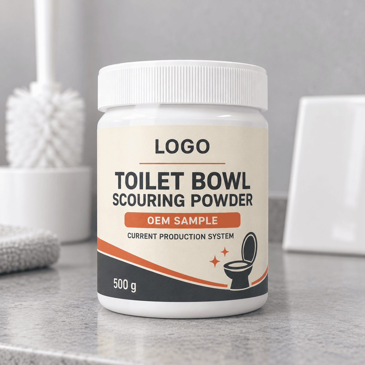 White 500 g wide-mouth jar with ribbed lid and cream, charcoal and rust-orange LOGO, TOILET BOWL SCOURING POWDER, OEM SAMPLE and CURRENT PRODUCTION SYSTEM label on a grey counter beside a blurred toilet brush and ceramic tile
